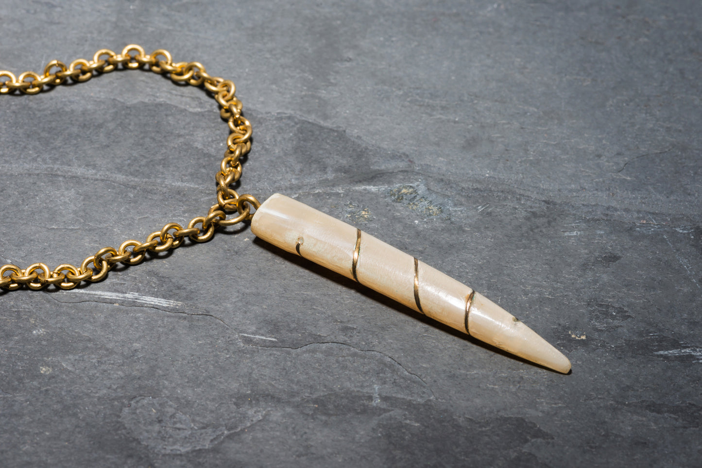 OND TUSK BRASS PENDANT