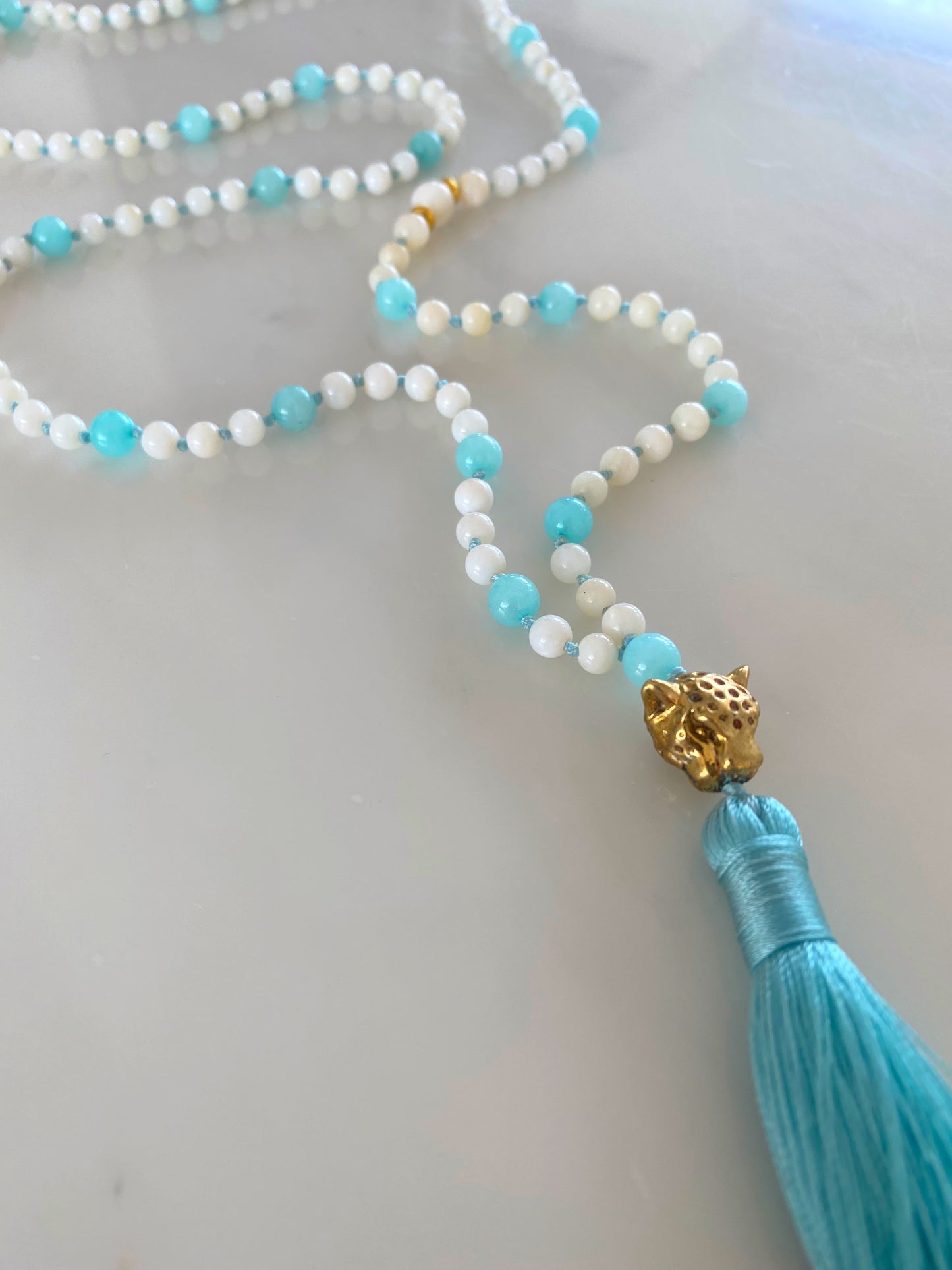 AQUA ISLAND BEACH LEO TASSEL