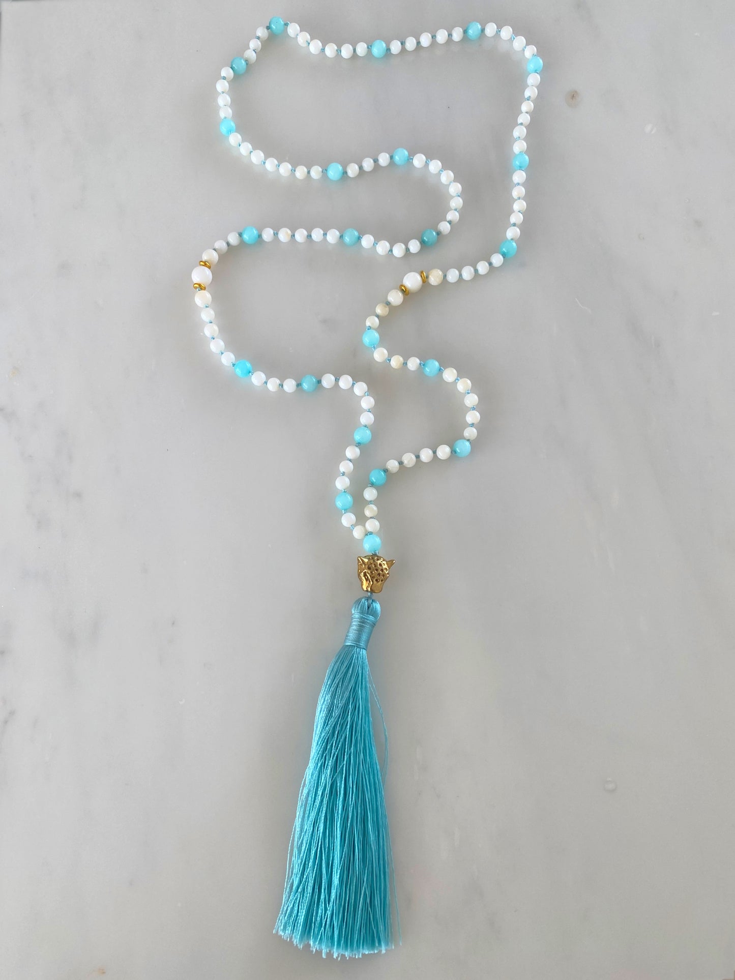 AQUA ISLAND BEACH LEO TASSEL