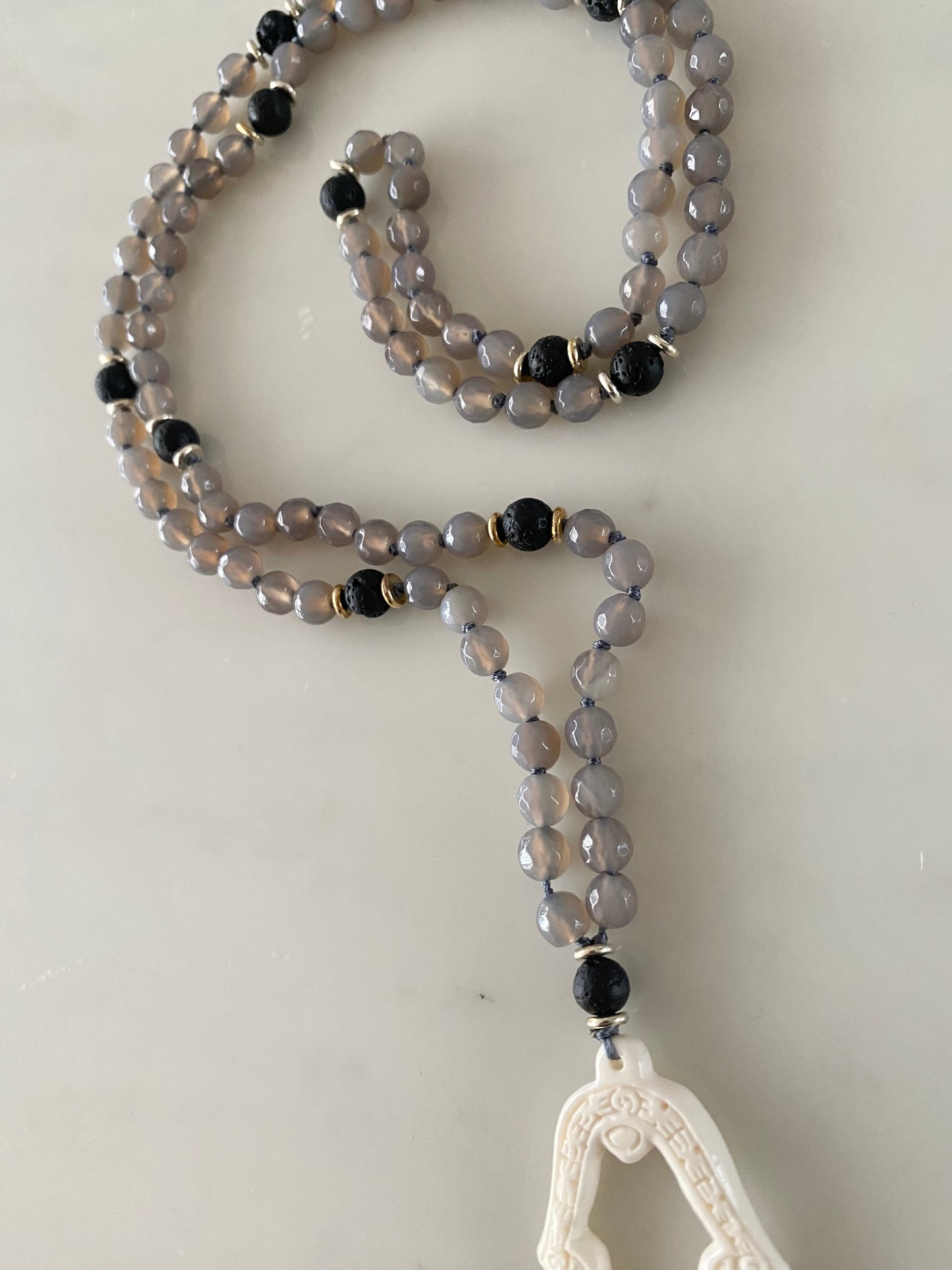 GREY AGATE VOLCANIC PRAYER HAND NECKLACE