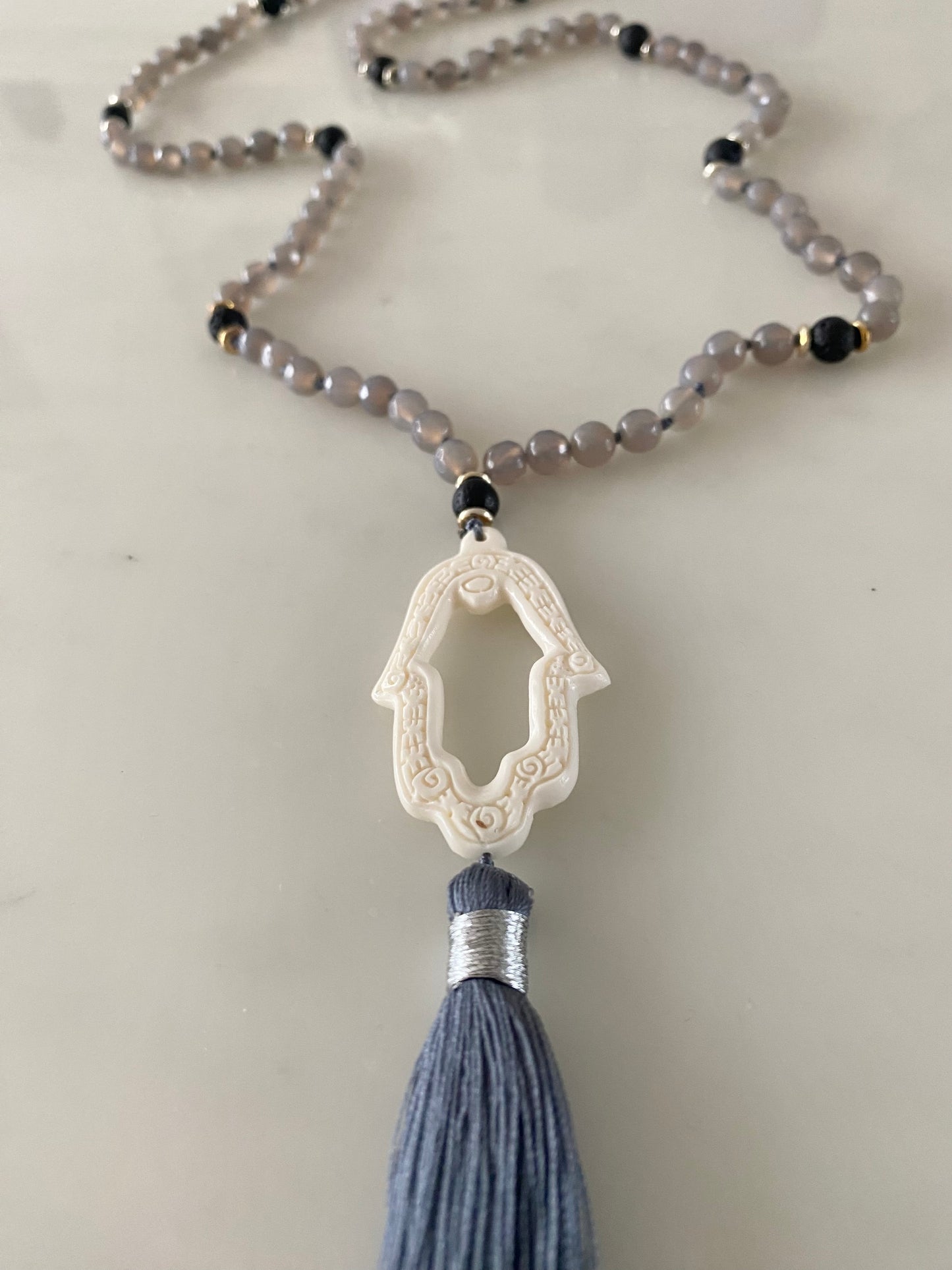 GREY AGATE VOLCANIC PRAYER HAND NECKLACE