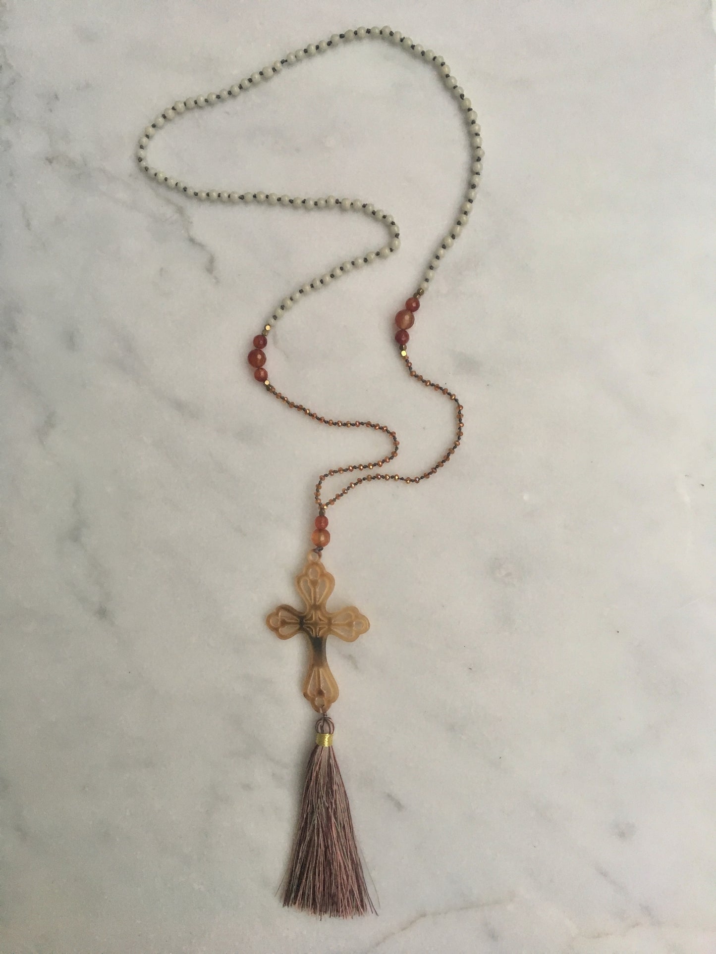 AMBER AMULET HORN CROSS WITH TASSEL