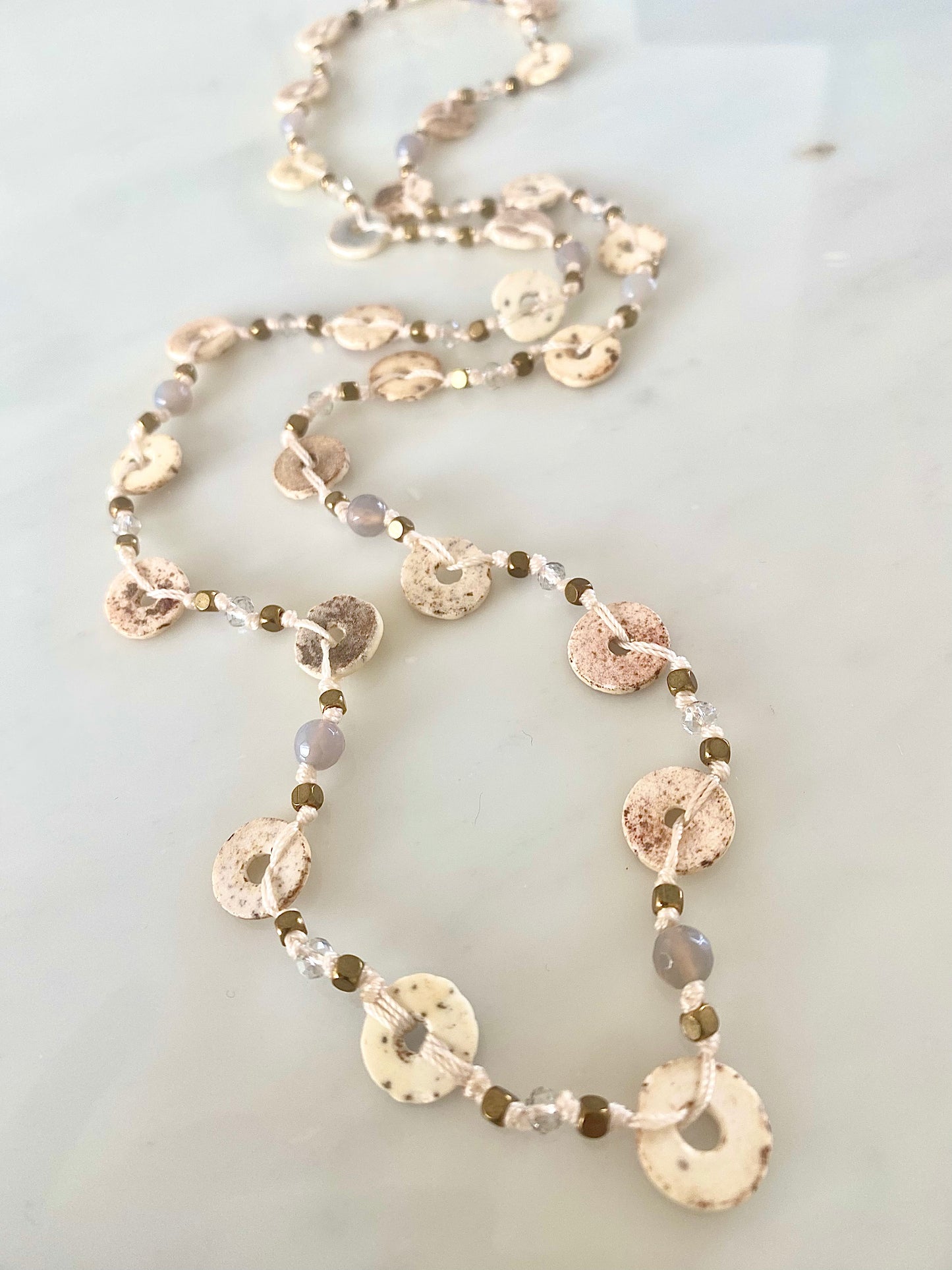 OSTRICH SHELL WANDERLUST NECKLACE